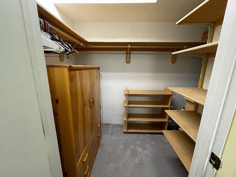 Walk-in closet & armoire.