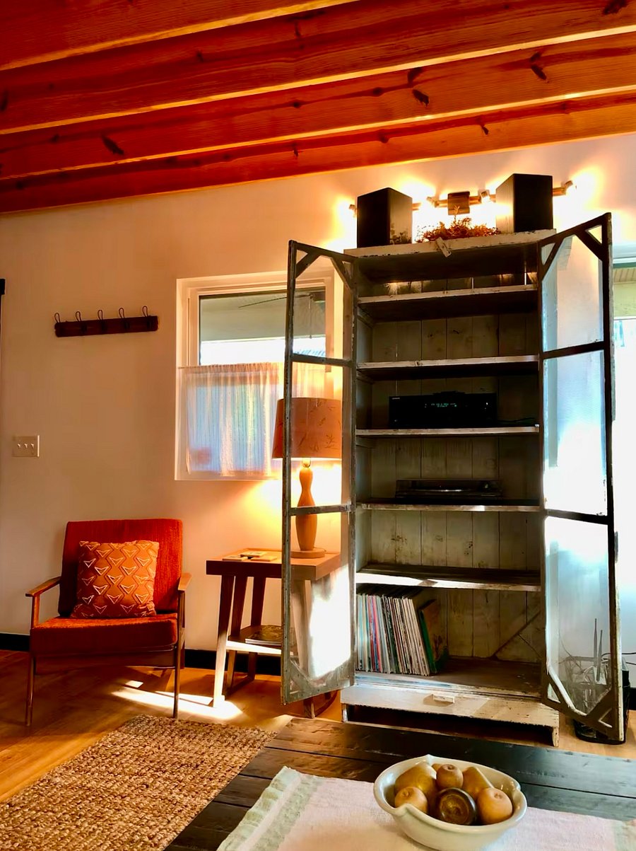 Antique pie safe now serves as a fashionable media cabinet