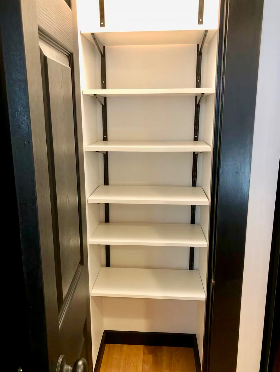 Spacious pantry in kitchen with lots of shelves for food storage!