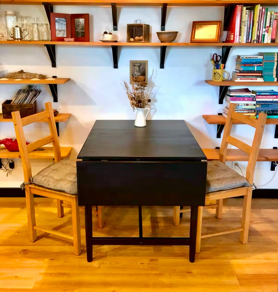 Small dining area with expandable table and extra chairs available