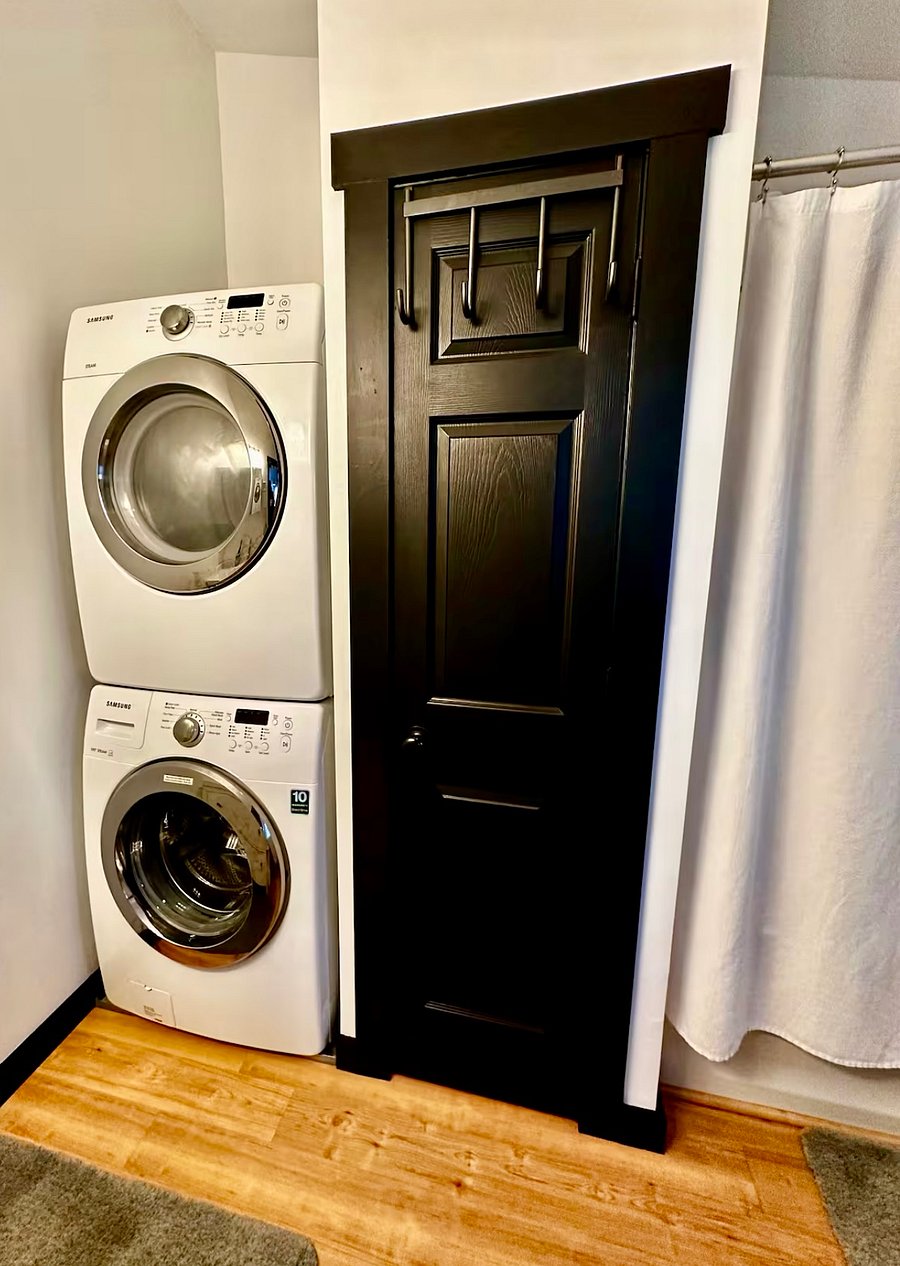 Front-loading washer/dryer and linen closet conveniently located in full bath