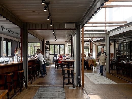Smoky Park Supper Club is a super hip restaurant built out of shipping containers, and it's right around the corner.
