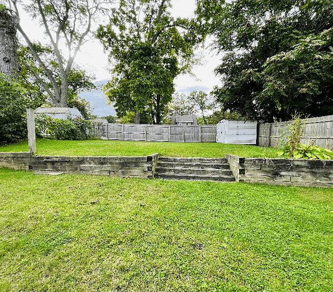 Plenty of room for lawn games in private backyard