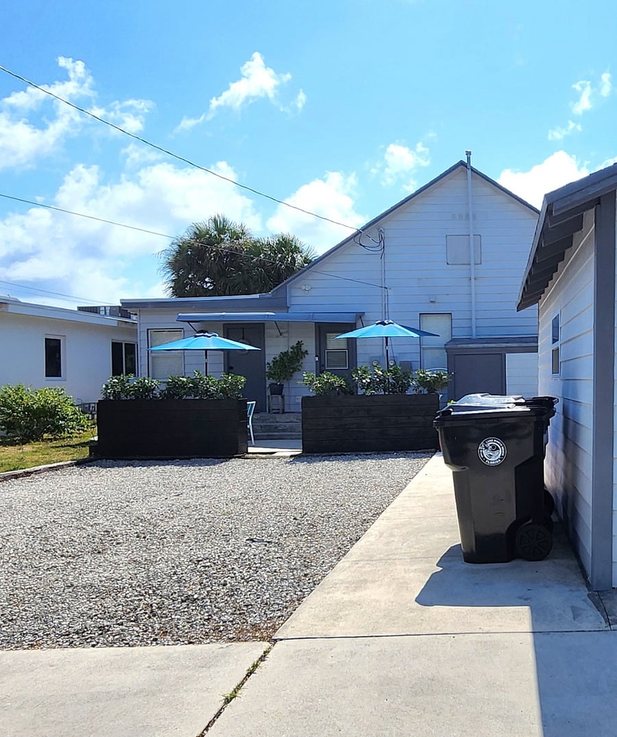 The back of the house where the studio is located.