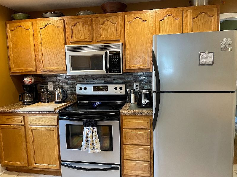 Fully equipped kitchen including spices and various baking items