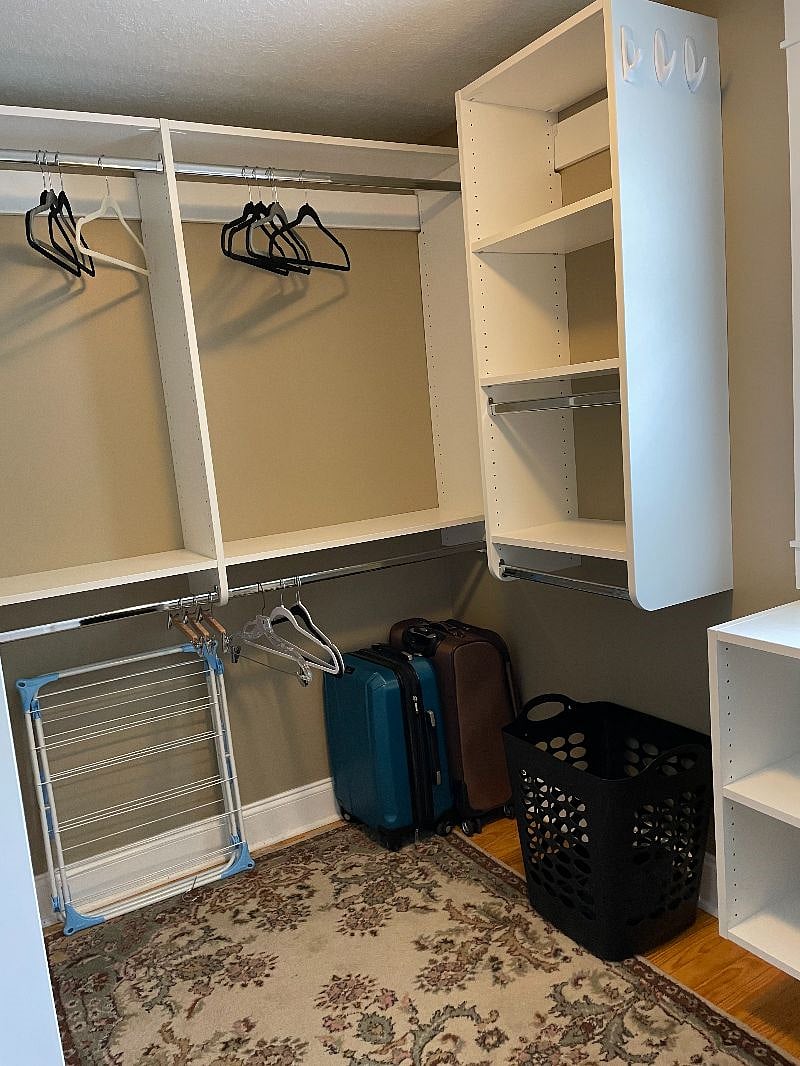 Walk in closet with tons of storage
