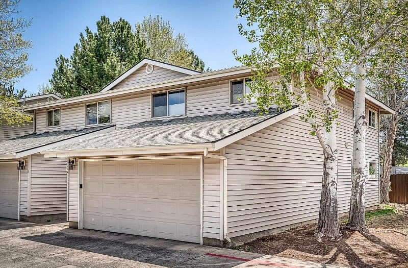 Quiet, tucked away end-unit. View of front entrance and attached 2-car garage.
