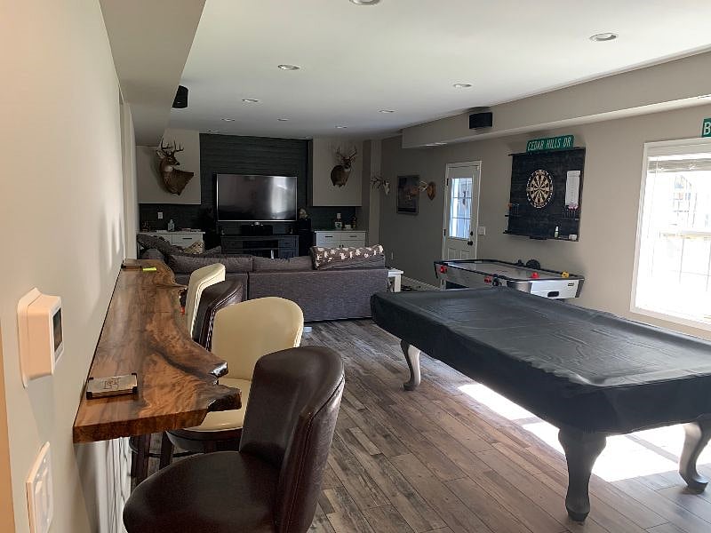 Basement 2nd living room with cable, dart board & pool table