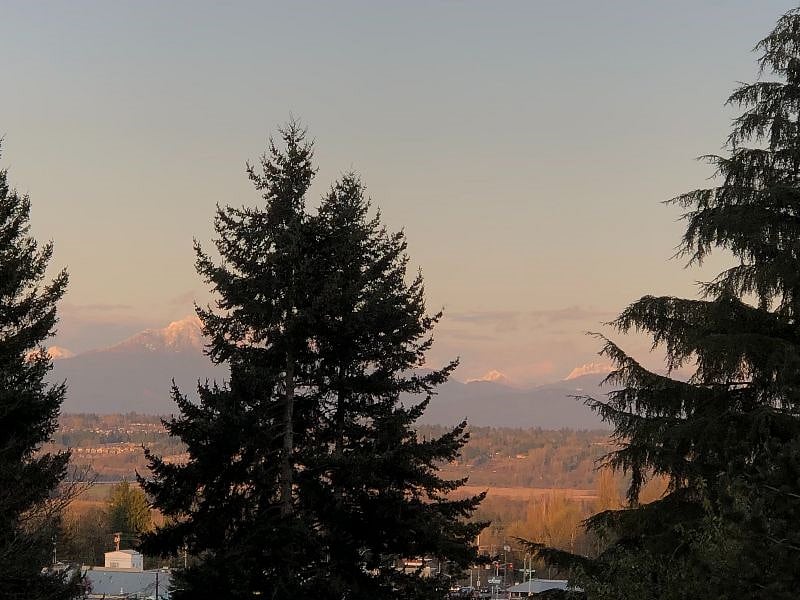 Sunset view of the Cascade Mountains from private backyard.