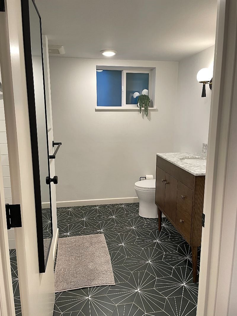 Spacious bathroom with walk in shower and laundry inside