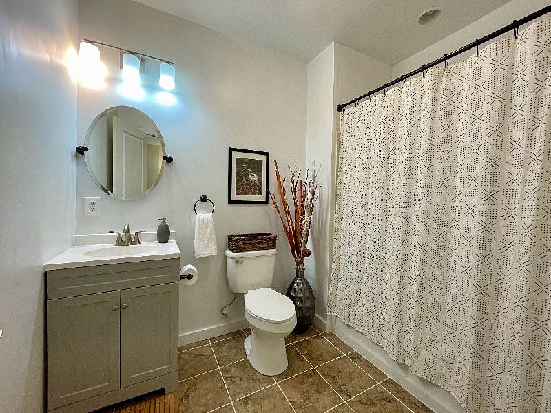 The first floor private bathroom features a tub/shower combination.