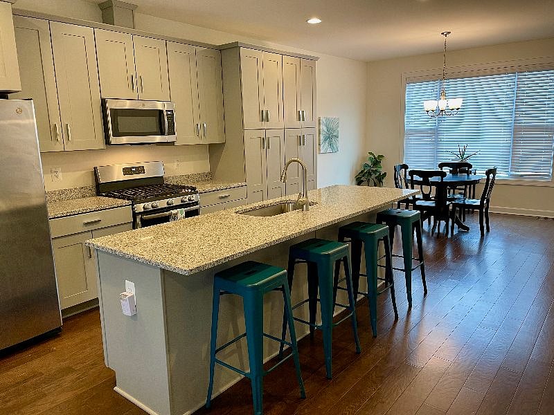 Gourmet kitchen with gas range and large island has all the amenities you need. Plenty of room in the kitchen for cooking and hanging out!