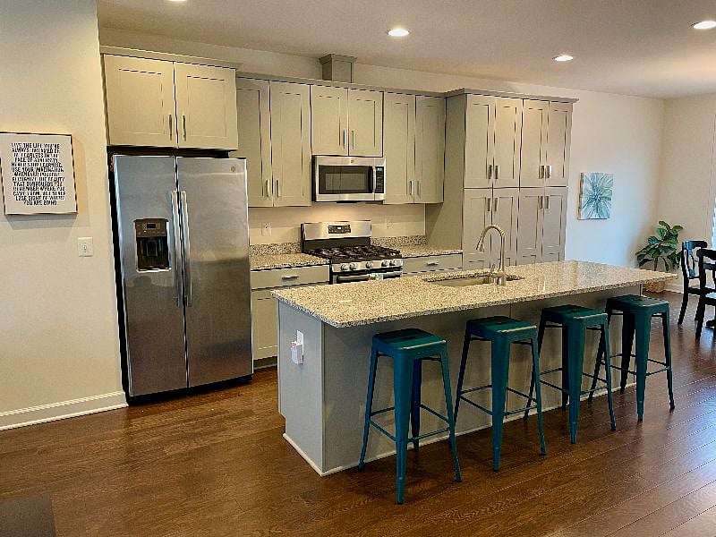 Gourmet kitchen with gas range and large island has all the amenities you need.