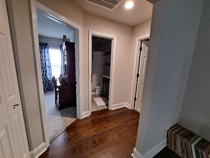 Hallway leading to bedrooms and guest bath.