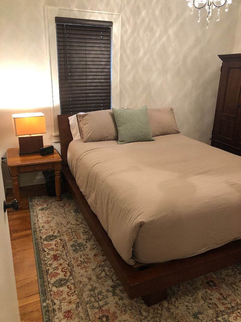 Bedroom with a comfy queen bed. Also has blackout drapes for those working night shifts. 

