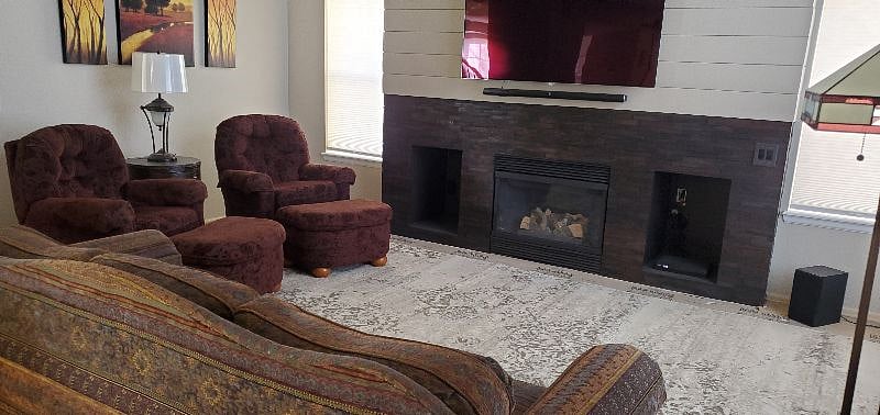 The recently updated great room on the main floor of the home includes a fireplace and 65" 4K television.