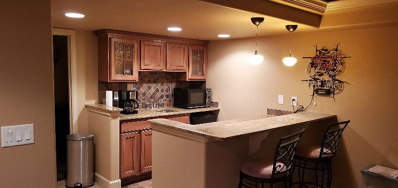 Guests have a wet bar/kitchenette in their private quarters plus full access to the home's kitchen and laundry area on the main floor.