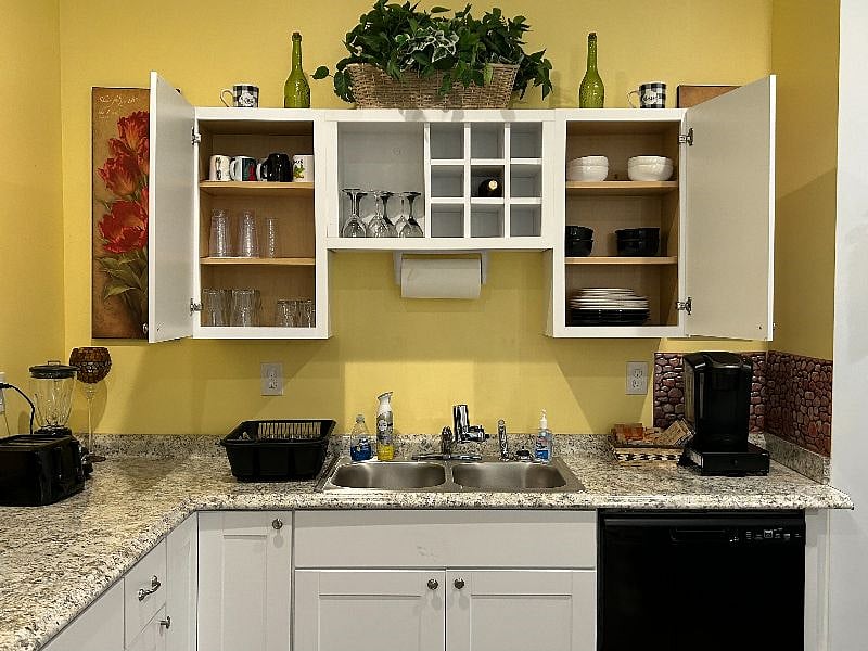 upper and lower cabinets with wine rack