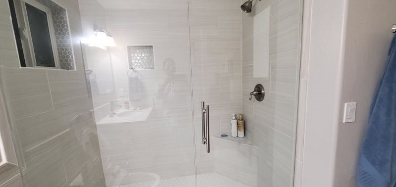 Fully functional standing shower with all tiles.