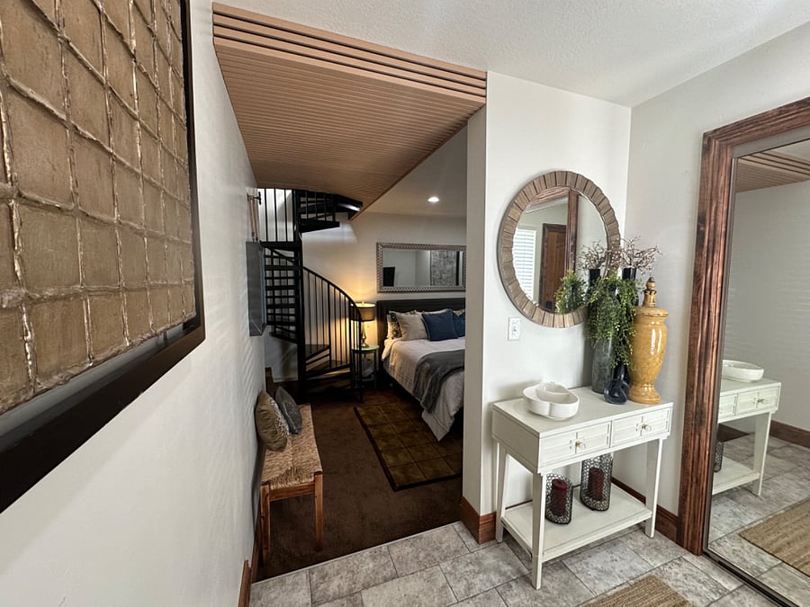 View from entry into bedroom with new queen bed