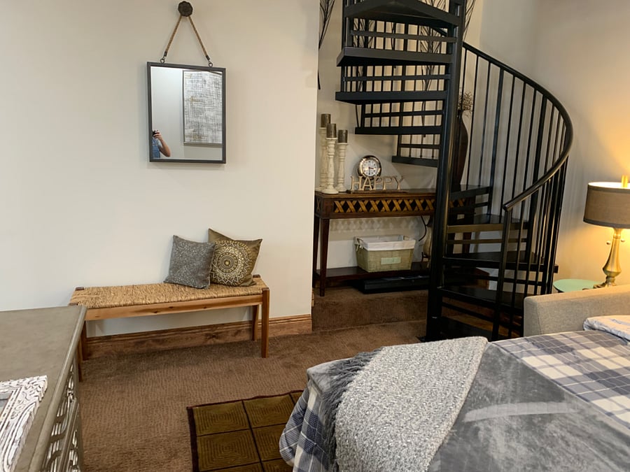 Spiral staircase leading to upstairs living area