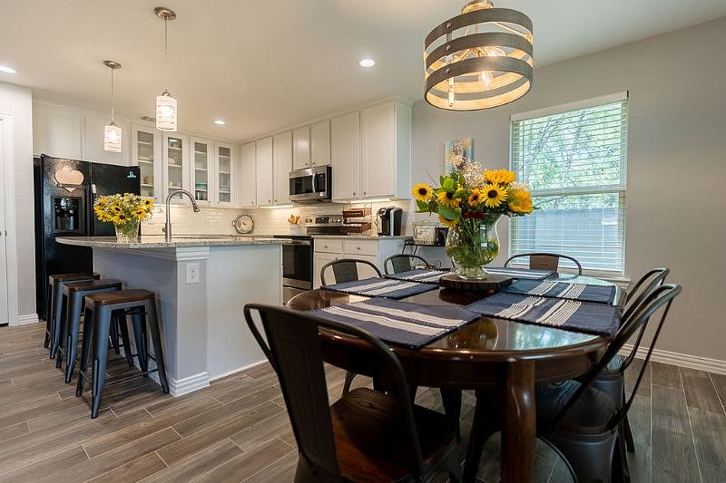 Dining Area and Kitchen - Oven features convection and air fryer capabilities.