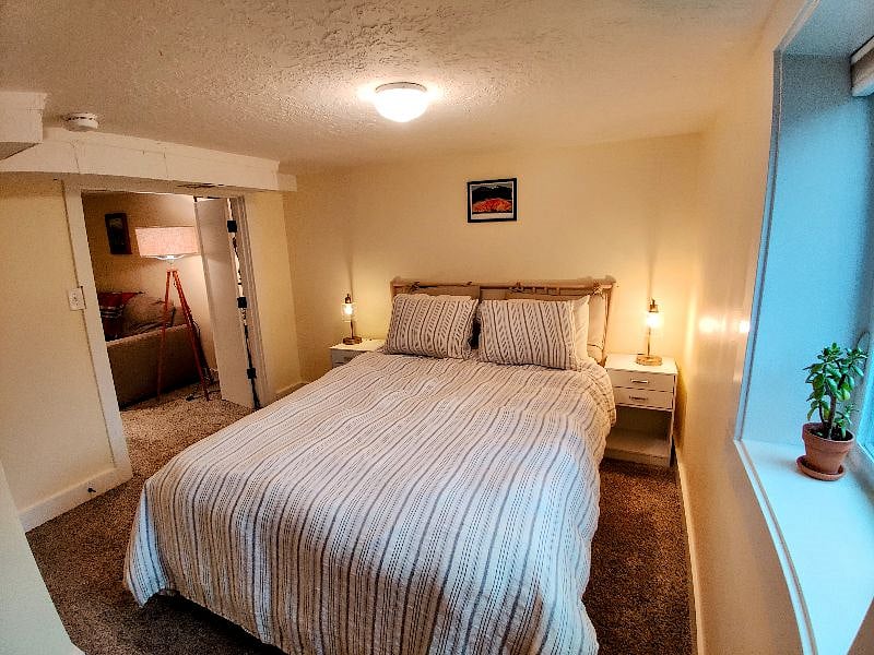 Very comfortable queen size tuft and needle bed with linen duvet and lots of pillows. Bedside tables equipped with charging station and lots of places to charge phones and other devices.