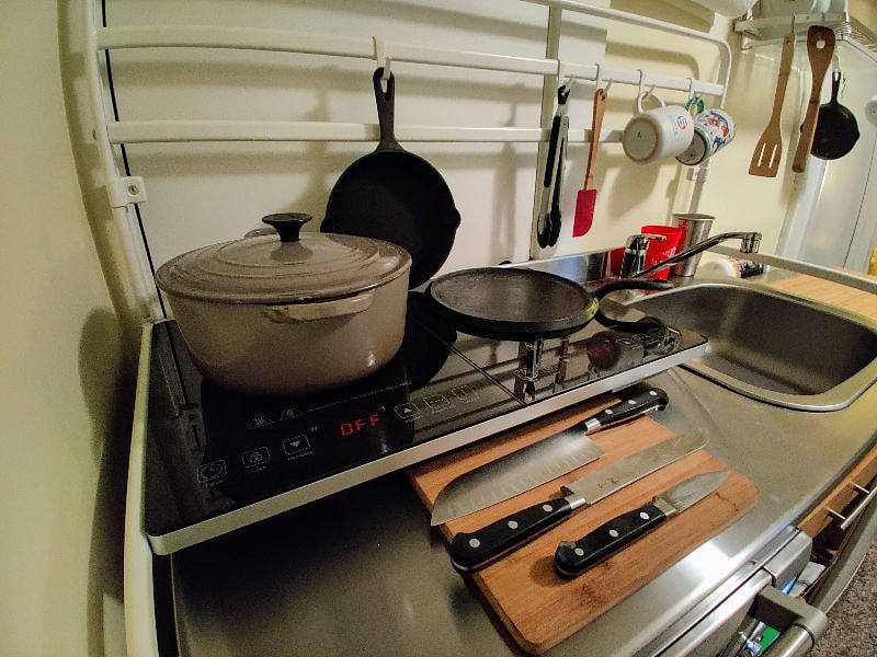 High powered cook top equipped with cast iron and induction ready pots and pans. Breveille
