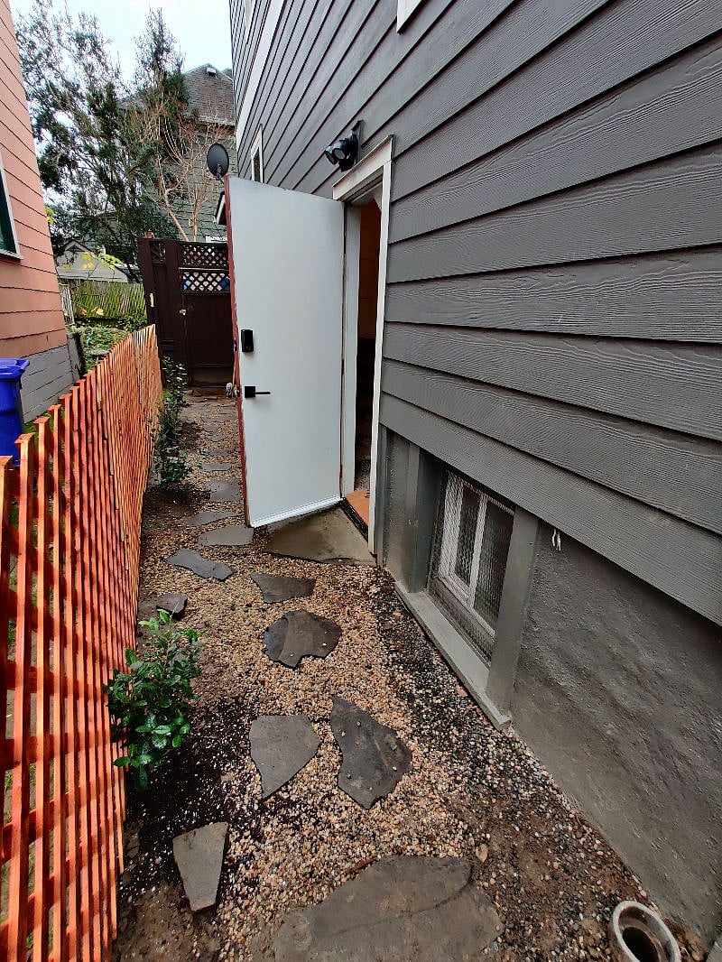 Private walkway to private key & key pad equipped entrance.
