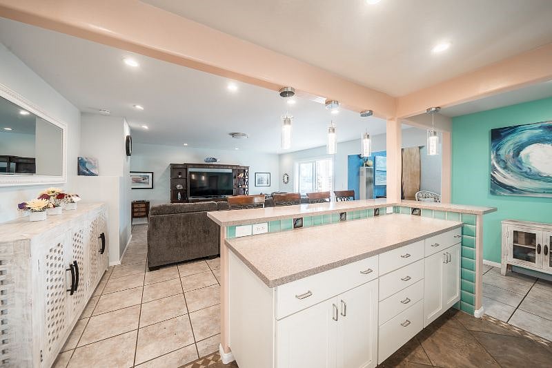 Large multi-level island for entertaining or work station with multiple outlets.