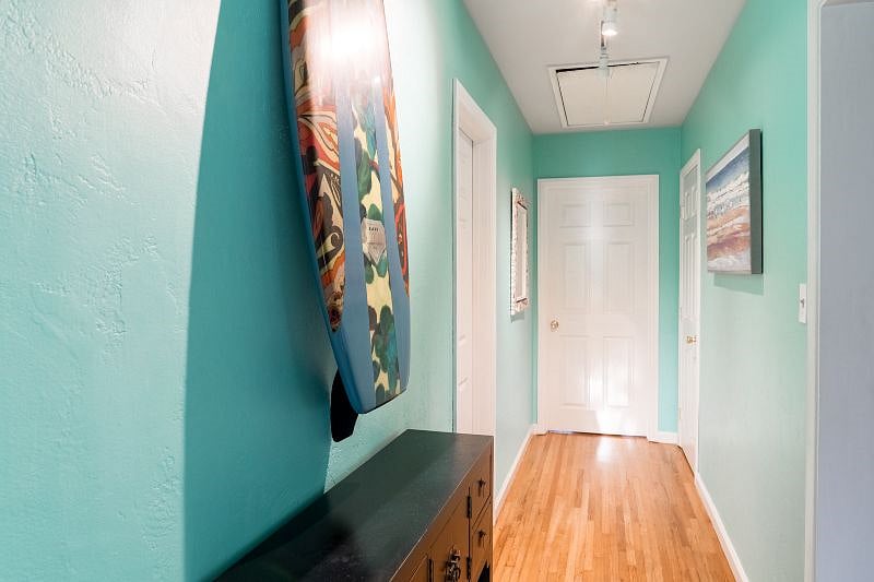 Hallway connecting Master 2 with Bedroom 3. Bathroom 3 in the hallway.