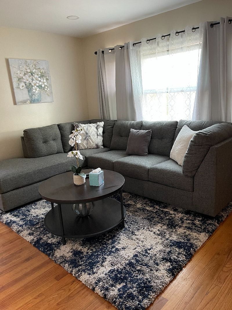 Living room with sofa sleeper and wall sound bar