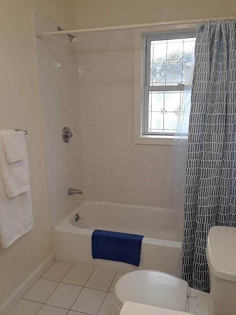 Bathroom with full size tub and shower.