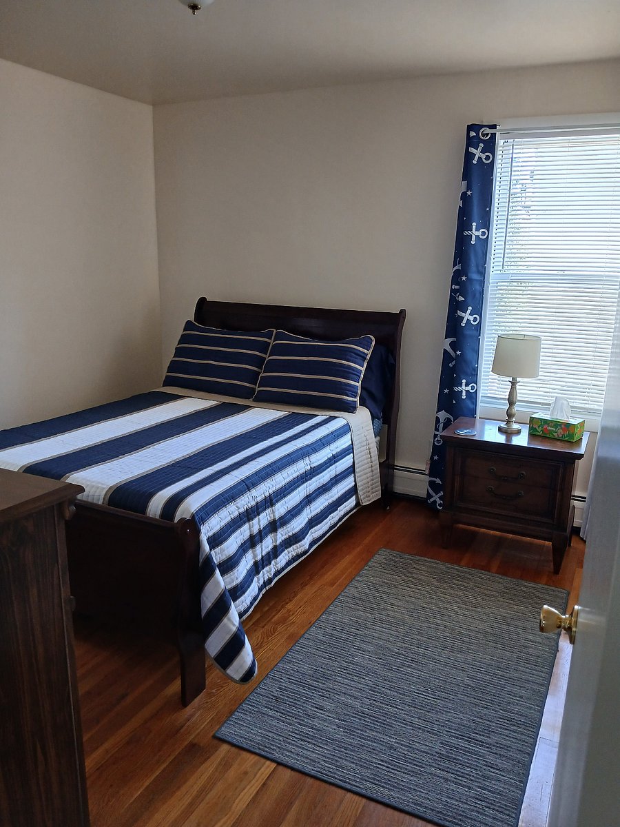Bedroom 1. Full size bed. Blackout curtains.