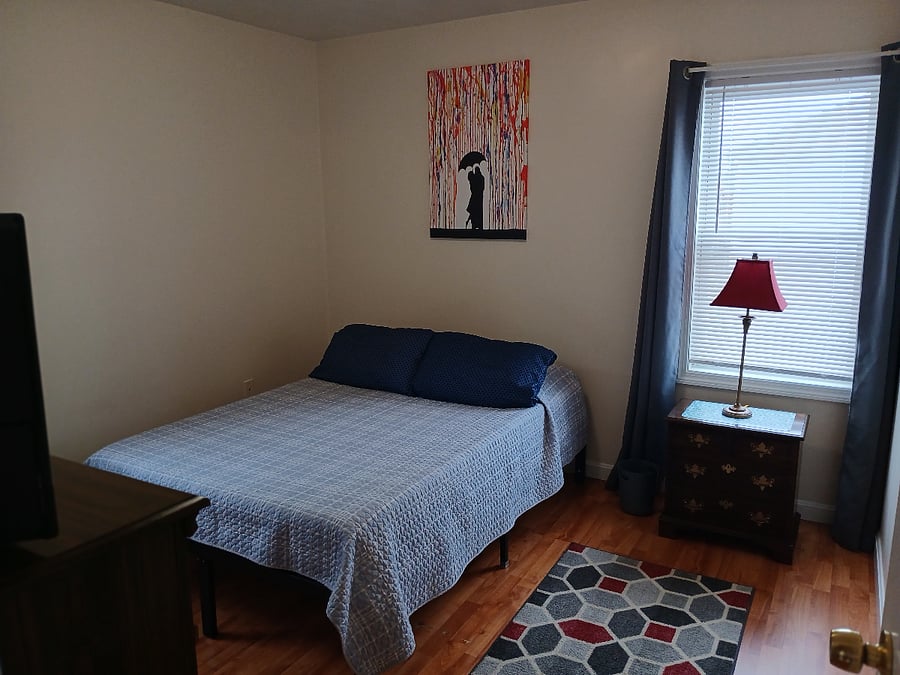 Bedroom 1. Full size bed. Blackout curtains.
