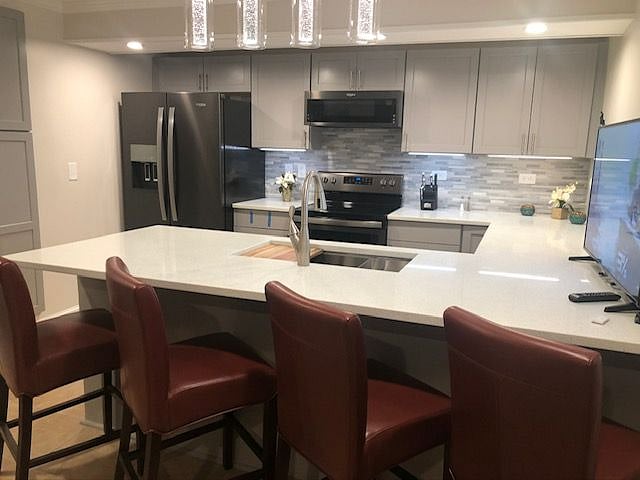All new appliances including dishwasher, quartz countertops, and new appliances