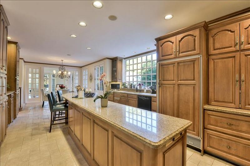 Beautiful chef"s kitchen with lots of space, six burner gas stove top, double ovens with convection feature.