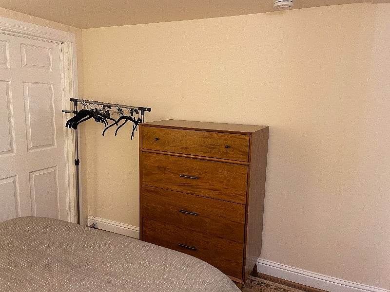 No closet, but the bedroom has a rack to hang clothing and an ample dresser