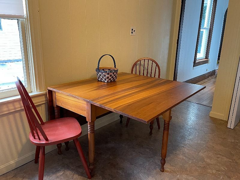 Kitchen table folds open or closed for more or less space.