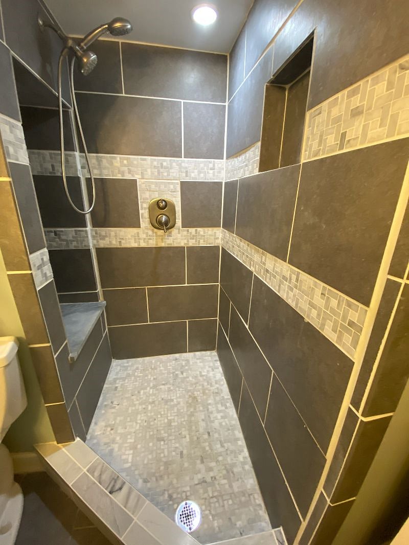 Shower with three separate spray heads & sitting area