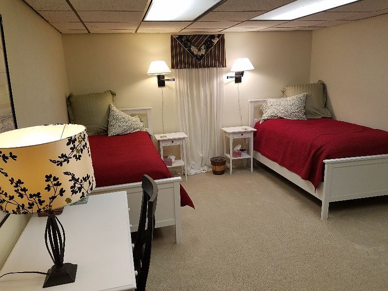 Non-conforming basement bedroom. Twin beds can be combined into king size bed.