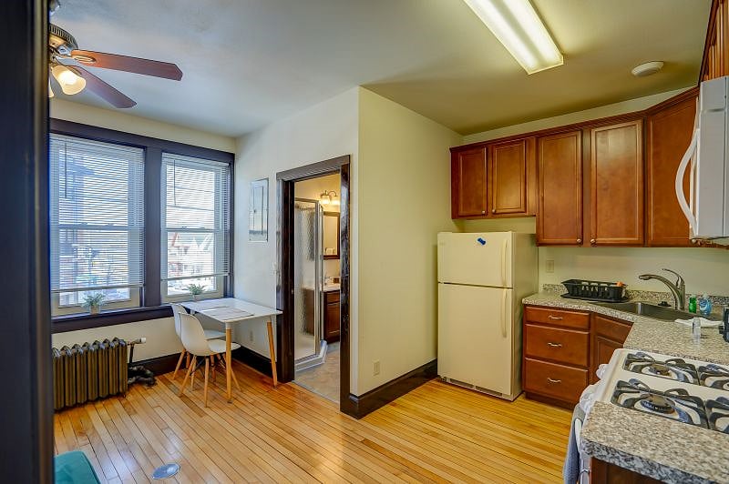 View of kitchen and work/dining table.