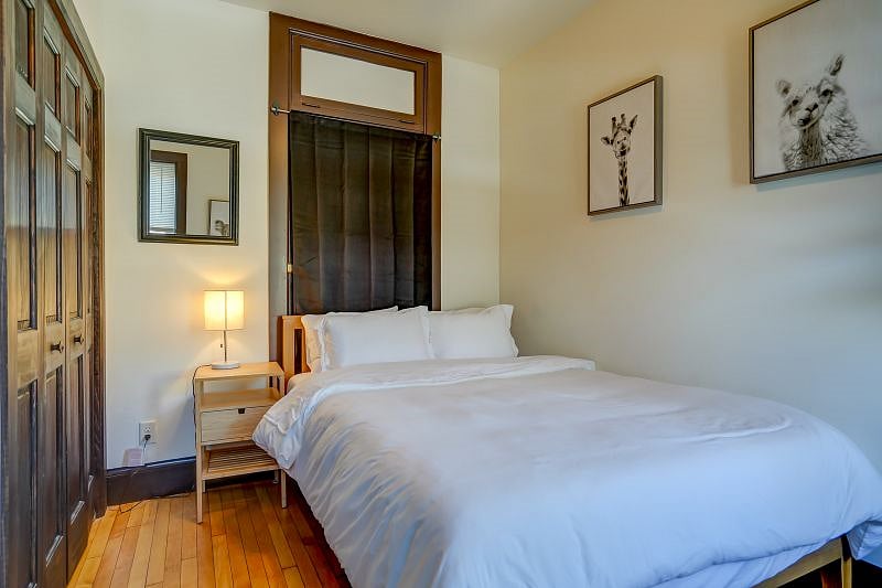 Bedroom with Queen bed, dresser, and closet!