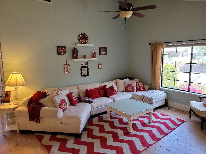 Large welcoming couch which faces the 65" ROKU Smart TV on the wall. Cuddle up with the family and watch your favorite show or flick.