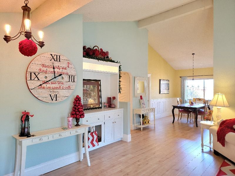 Front door entry is to the left in the photo. People love coming in and being awe inspired by the welcoming vaulted ceilings. Come in and stay a while!