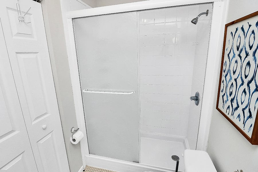 Charming bathroom with plenty of storage, offering a comfortable and practical space.