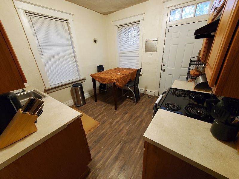 Another view of kitchen with bar height breakfast table