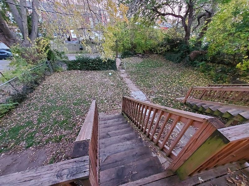 view down shared back deck steps to shared back yard
