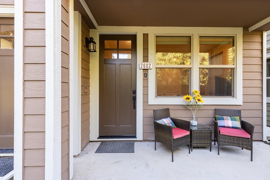 Rental unit front door and private outdoor seating area