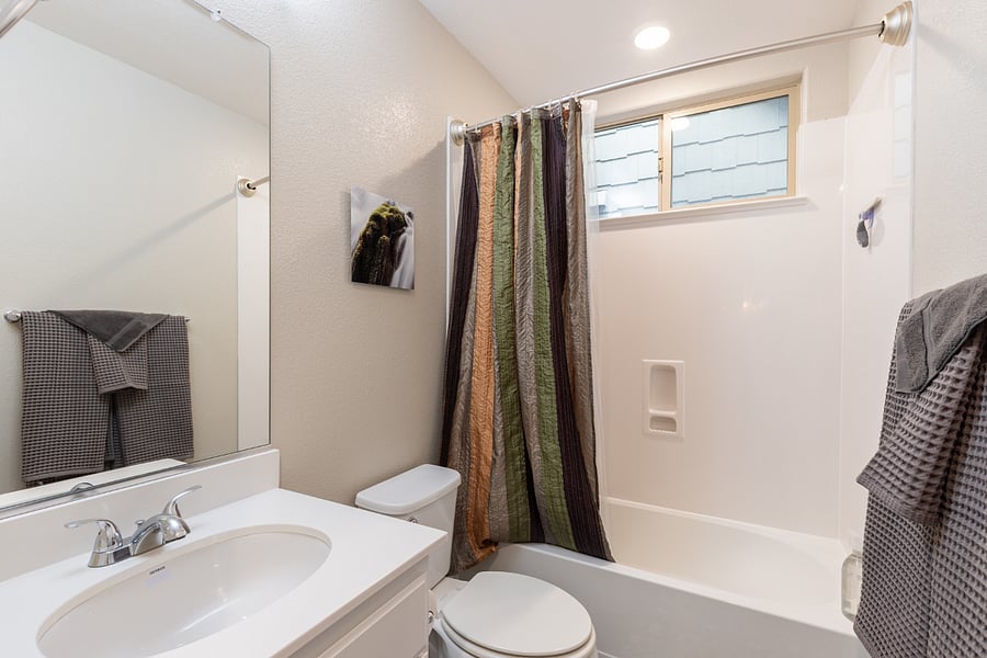 bathroom with tub and shower